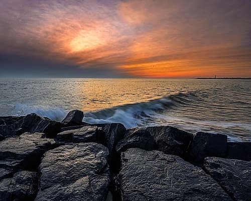 New Jersey-Cape May National Seashore Sunset on ocean and rocks Coastal Print